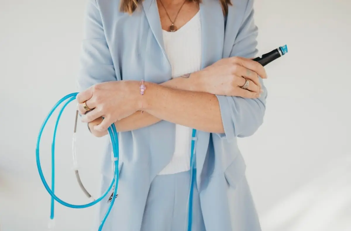 Close detail of Esthetically Kate Spa's Hydrafacial handpiece held in soft natural light